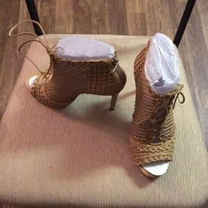 Nude colored lace up peep-toe booties